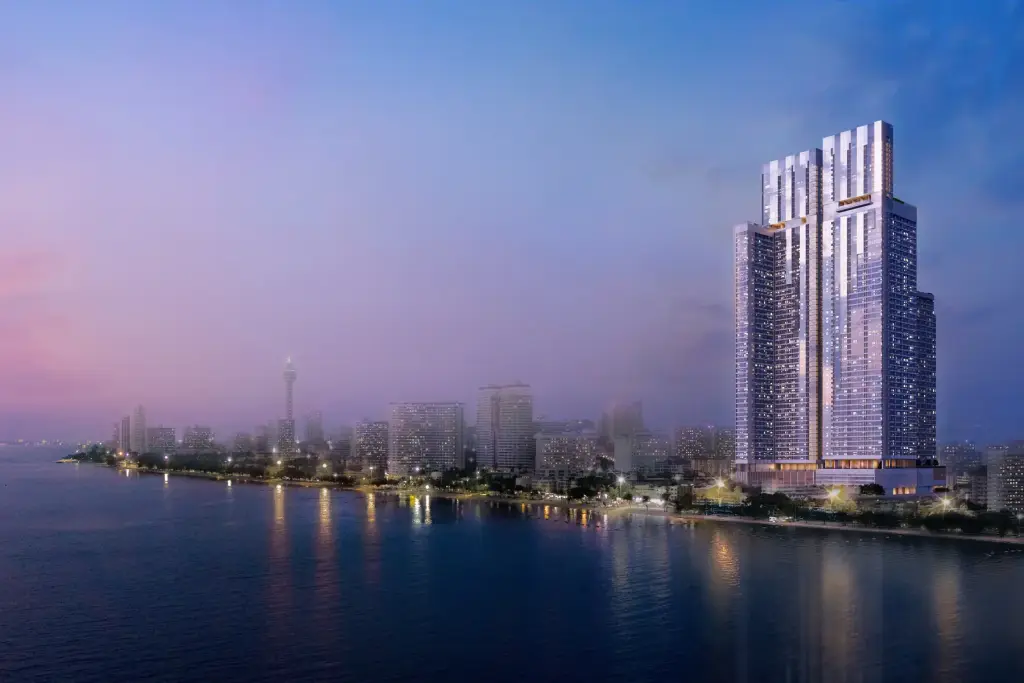 SKYPARK Lucean Jomtien Pattaya rooftop sky pool with lounge chairs and city skyline view at dusk.