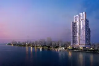 SKYPARK Lucean Jomtien Pattaya rooftop sky pool with lounge chairs and city skyline view at dusk.