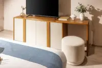 Studio Condo for Sale at SKYPARK Lucean Jomtien Pattaya open-plan living area with double bed, built-in shelving, TV unit and floor-to-ceiling windows