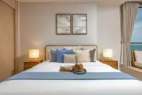Studio Condo for Sale at SKYPARK Lucean Jomtien Pattaya lounge chair and side table with panoramic city and sea view