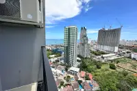 2 Bedroom Condo for Sale at The Twin Tower Jomtien Beach Pattaya balcony view of Jomtien skyline with high-rise towers and sea in the distance