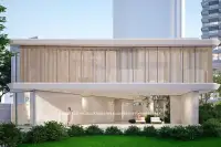 3 Bedroom House for Sale at Soondri Wongamat modern clubhouse with timber slat upper level and lush landscaping