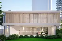 3 Bedroom House for Sale at Soondri Wongamat two-story building facade with wooden slats and poolside loungers