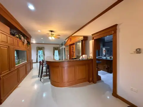 6 Bedroom House for Rent at SP Village 5 wooden bar counter with stools next to built-in fish tank