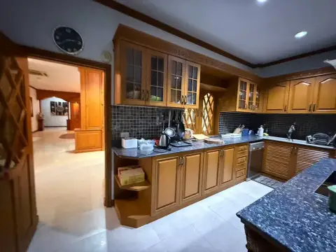 6 Bedroom House for Rent at SP Village 5 fitted kitchen with wood cabinets and granite countertops