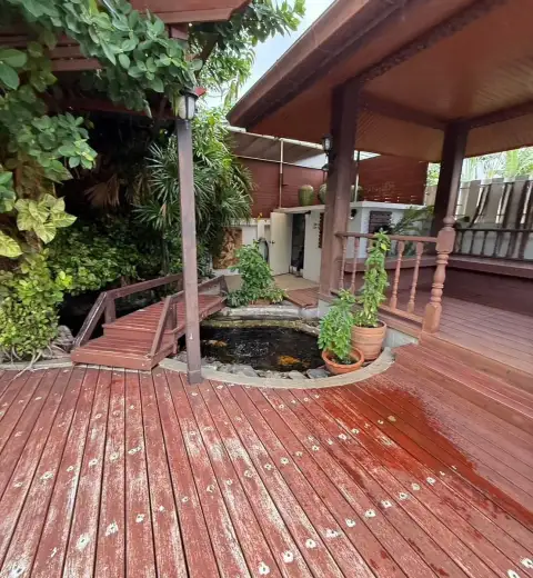 6 Bedroom House for Rent at SP Village 5 outdoor wooden deck with koi pond and covered pavilion