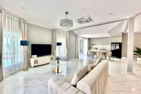 4 Bedroom House for Sale at Srisuk Villa open-plan living room with chandelier and marble flooring