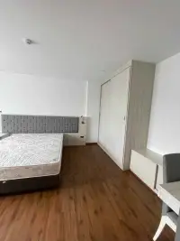 2 Bedroom Condo for Rent at Stasia Dormy Residence bedroom corner with built-in wardrobe and study desk