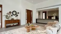 2 Bedroom House for Sale at Sunplay Bangsaray living room with wooden sideboard and view into open kitchen