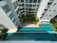 1 Bedroom Condo for Sale at Sunset Boulevard Residence 1 aerial view of outdoor swimming pool and sun loungers