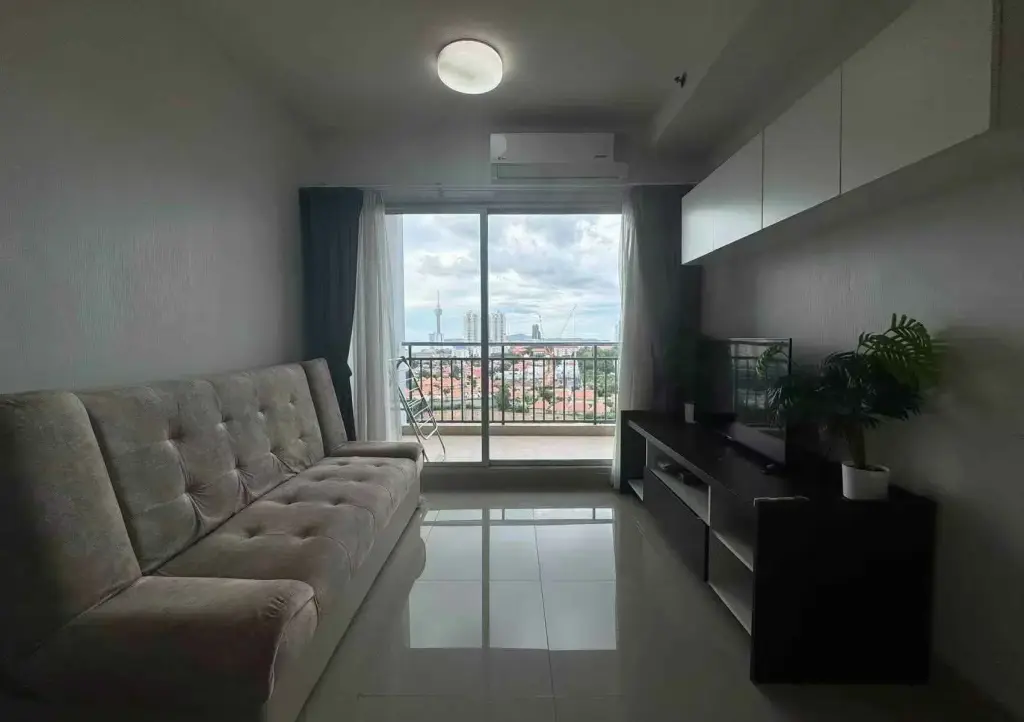 1 Bedroom Condo for Sale at Supalai Mare Pattaya living room with sofa, balcony access and city view