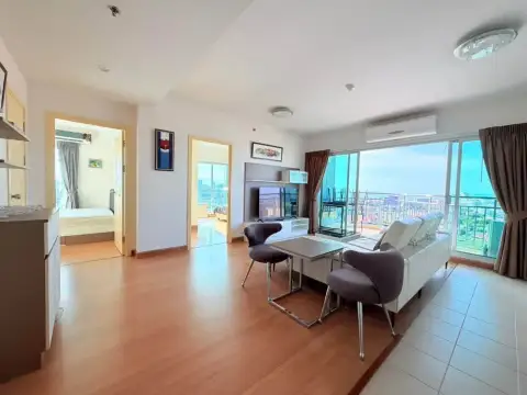 2 Bedroom Condo for Rent at Supalai Mare Pattaya spacious living room with dining chairs and panoramic city view