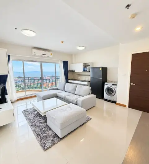 2 Bedroom Condo for Sale at Supalai Mare Pattaya open-plan living area with kitchen and washing machine