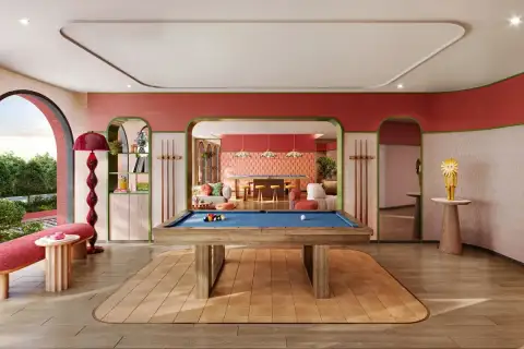 D Condo Vite colorful game room featuring a pool billiards table, lounge seating, and vibrant retro-style interior decor