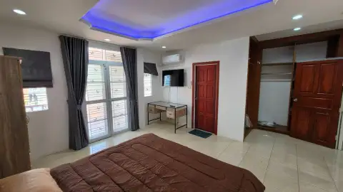 3 Bedroom House for Rent at T.W. Palm Resort master bedroom with mood lighting, TV and walk-in closet