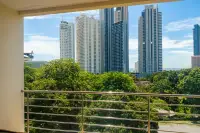 2 Bedroom Condo for Rent at Wongamat Privacy covered balcony with steel railing and panoramic view of Wongamat highrise towers