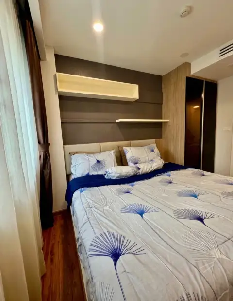 1 Bedroom Condo for Sale at Dusit Grand Park 1 bedroom with wall-mounted TV and curtained window