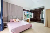 4 Bedroom House for Rent in Takhian Tia master bedroom with pink bedding and glass wardrobe