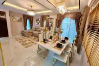4 Bedroom House for Rent in Takhian Tia open-plan living and dining area with crystal chandeliers