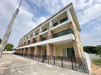 4 Bedroom Townhouse for Sale in Takhian Tia three-story exterior with balconies and black railings under blue sky