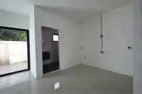 4 Bedroom Townhouse for Sale in Takhian Tia empty room with sliding glass door, doorway, and exposed wall wiring