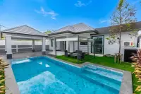 3 Bedroom House for Sale at Phonthep Garden Ville 2 private pool with tiled terrace and green lawn in walled backyard