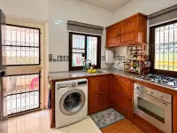 3 Bedroom House for Sale & Rent in East Pattaya kitchen with wooden cabinets, gas stove, oven and washing machine