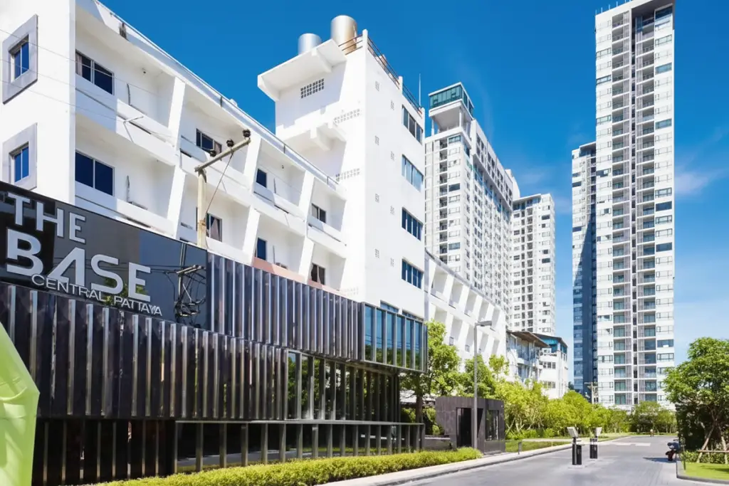 The Base Central Pattaya exterior view with modern buildings and prominent signage during the day.