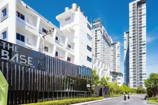 The Base Central Pattaya exterior view with modern buildings and prominent signage during the day.