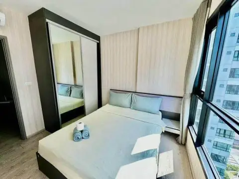 1 Bedroom Condo for Sale at The Base Central Pattaya bedroom with mirrored sliding wardrobe and large window