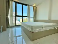 2 Bedroom Condo for Sale at The Cloud bedroom with wooden bed frame and city skyline view