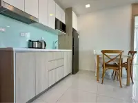 2 Bedroom Condo for Sale at The Cloud modern kitchen with mint backsplash and wooden dining table