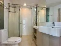 2 Bedroom Condo for Sale at The Cloud bathroom with glass shower enclosure and white vanity sink