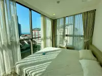 2 Bedroom Condo for Sale at The Cloud bedroom with floor-to-ceiling windows overlooking city buildings