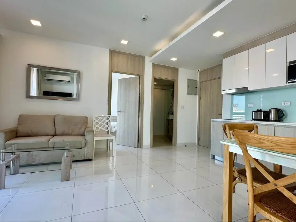 2 Bedroom Condo for Sale at The Cloud open-plan living room with sofa and adjoining kitchen area