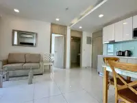 2 Bedroom Condo for Sale at The Cloud open-plan living room with sofa and adjoining kitchen area
