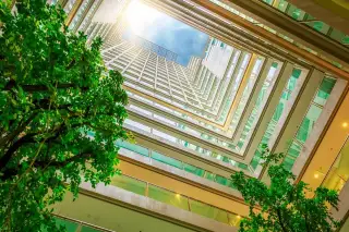 The Cloud aerial view of the outdoor swimming pool and the building's interior courtyard garden.