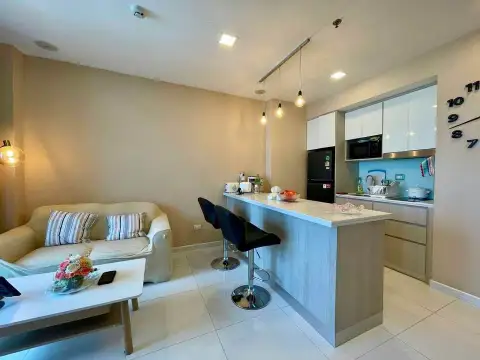 1 Bedroom Condo for Sale at The Cloud open-plan living room with sofa and kitchen breakfast bar
