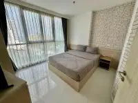 2 Bedroom Condo for Sale at The Cloud master bedroom with sea view through floor-to-ceiling windows