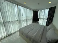 2 Bedroom Condo for Sale at The Cloud bedroom with large windows, TV stand, and city skyline view