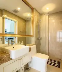 1 Bedroom Condo for Rent at The Empire Tower Pattaya bathroom mirror reflecting kitchen with rainfall shower and sink