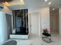 1 Bedroom Condo for Sale at The Empire Tower Pattaya entryway with marble TV console and hallway view