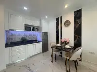 1 Bedroom Condo for Sale at The Empire Tower Pattaya kitchenette with dining table and patterned backsplash