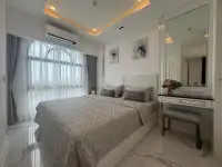 1 Bedroom Condo for Sale at The Empire Tower Pattaya bedroom with upholstered bed and vanity mirror