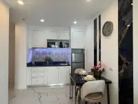 1 Bedroom Condo for Sale at The Empire Tower Pattaya compact kitchen with white cabinetry and dining nook