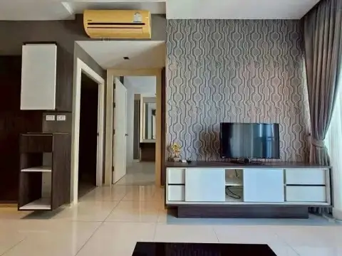 1 Bedroom Condo for Rent at The Gallery Condominium TV console with patterned wallpaper and hallway view
