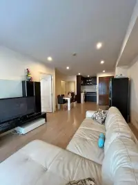 2 Bedroom Condo for Sale at The Ocean Pearl open-plan living and dining space with wood flooring and kitchen view