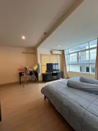 2 Bedroom Condo for Sale at The Ocean Pearl bedroom with balcony windows, TV stand, and drying rack