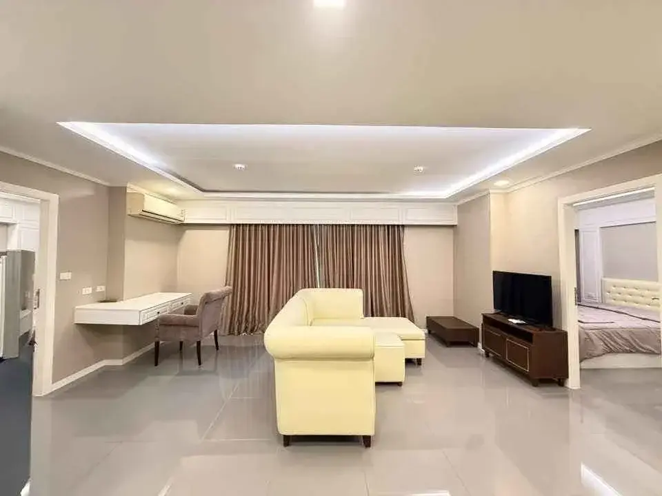 2 Bedroom Condo for Rent at The Orient Resort & Spa living room with cream sofa and TV unit