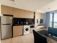 1 Bedroom Condo for Rent at The Panora Pattaya fitted kitchen with washing machine and ocean-view balcony